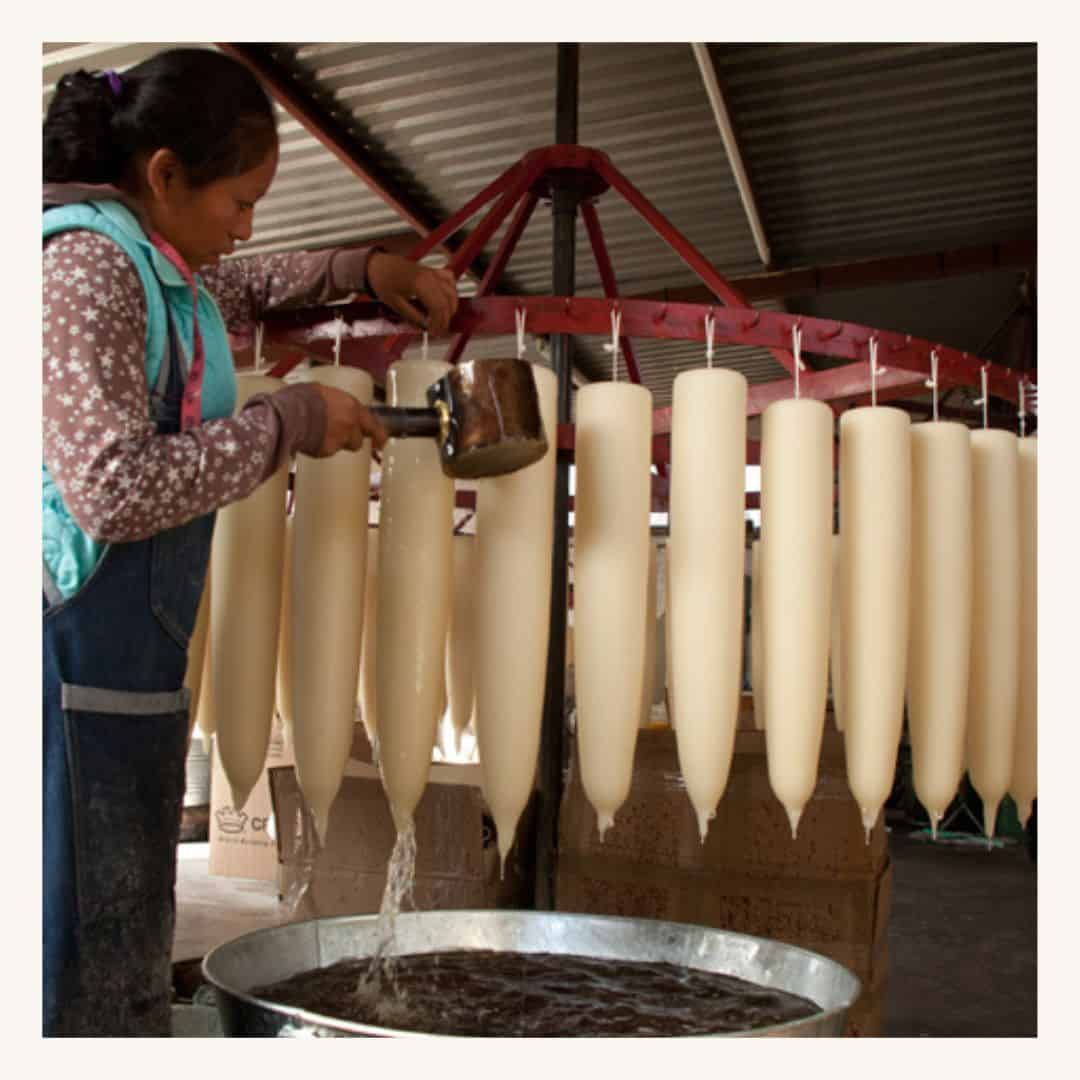 Woman making candles at a workshop in Mexico, featuring the impact of a San Miguel Community Foundation Nonprofit Network Member organization.